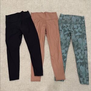 THREE pairs of kids athletic leggings